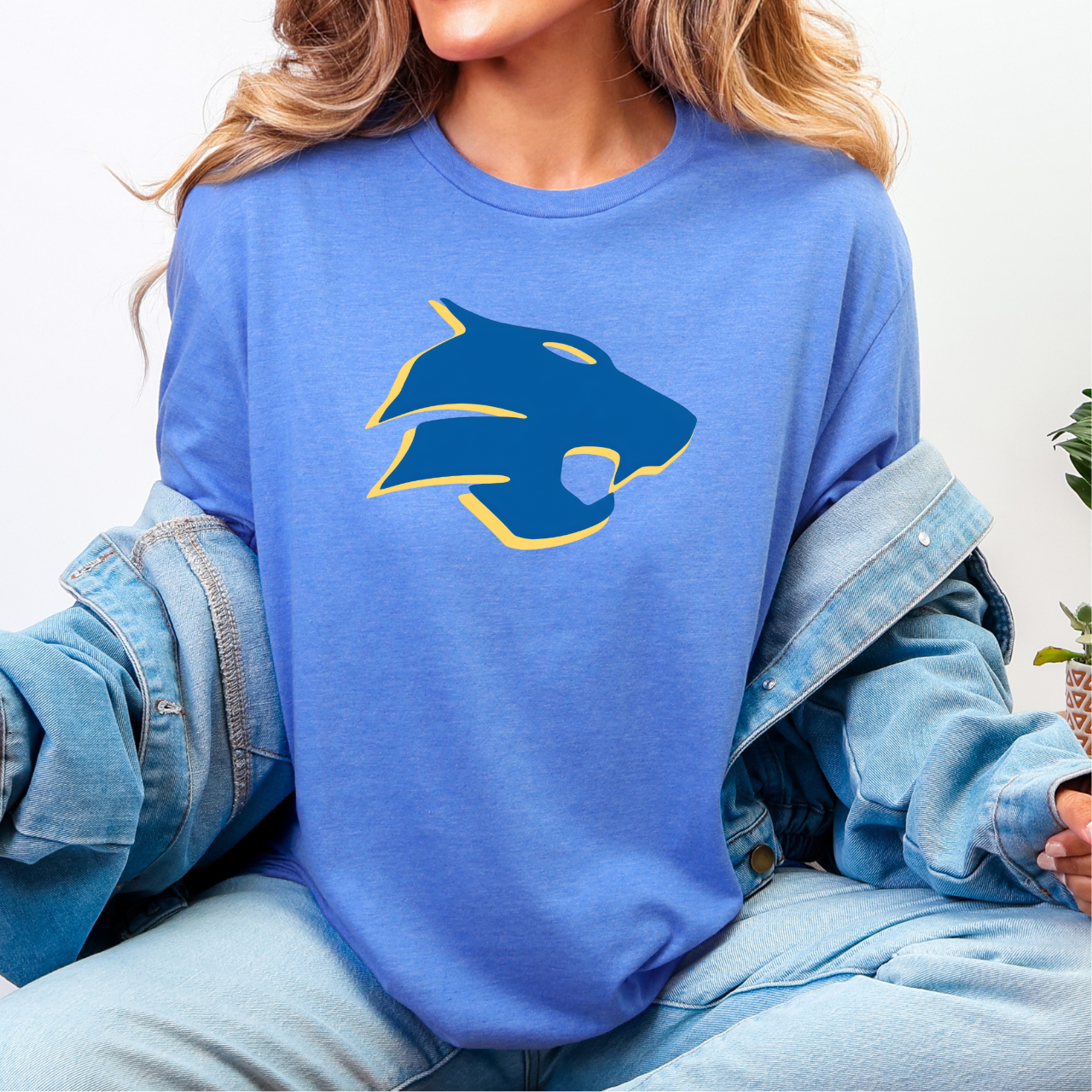 Person wearing a blue tee with a Durant Wildcats logo