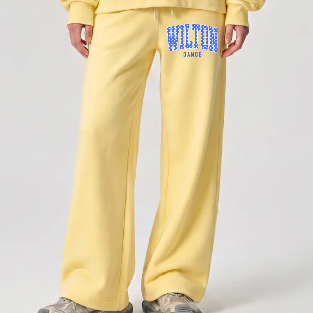 Wilton Polka Dot Dance wide leg sweatpants in yellow with blue and white Wilton dance design on the upper leg
