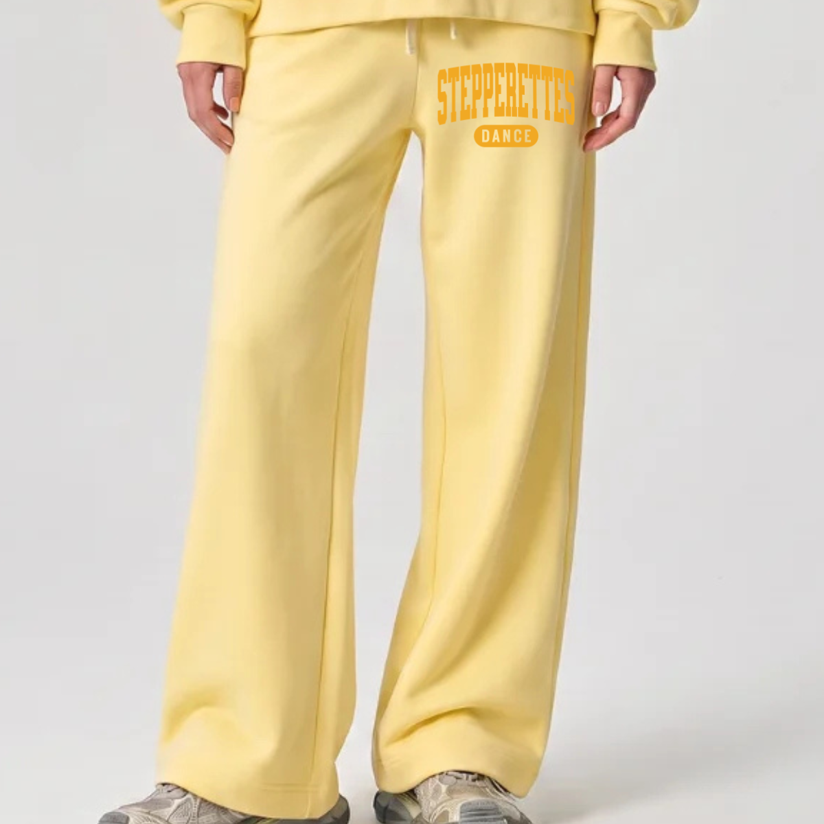 Wilton Stepperettes Dance wide leg sweatpants with gold Stepperettes Dance design on the upper leg